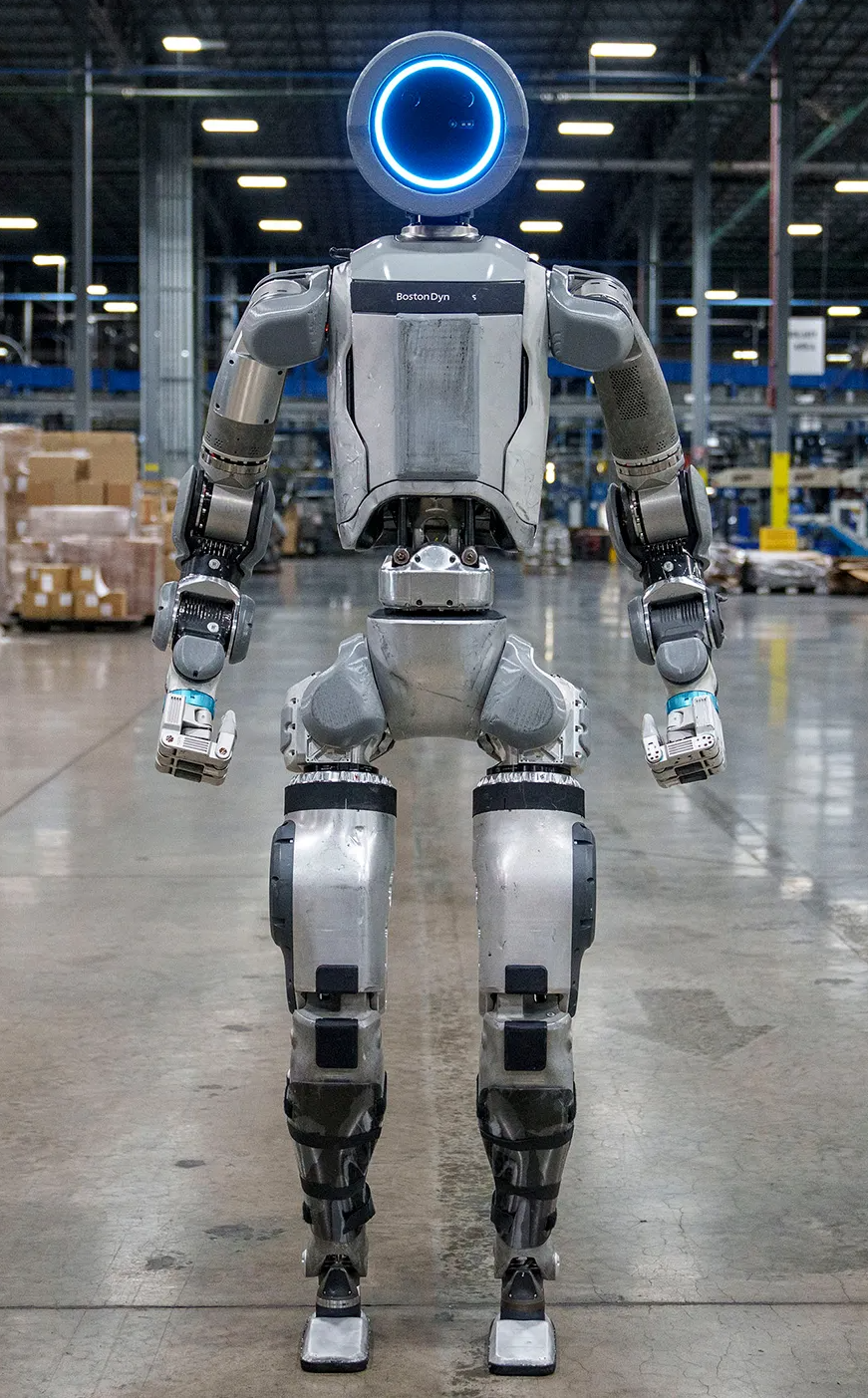 A humanoid Boston Dynamics robot standing in a warehouse (Wired/Boston Dynamics)