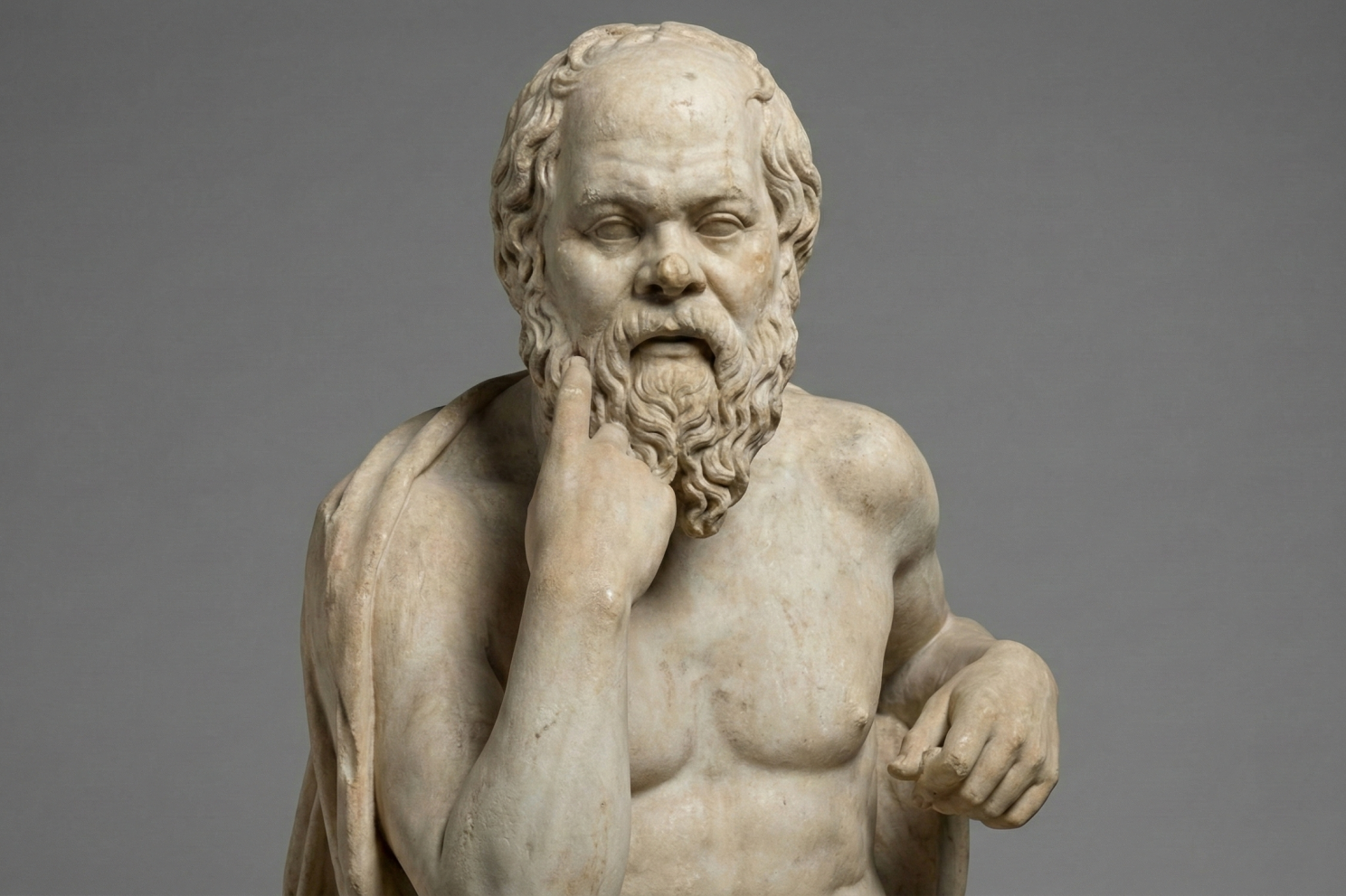 A marble statue of the philosopher Socrates, seated